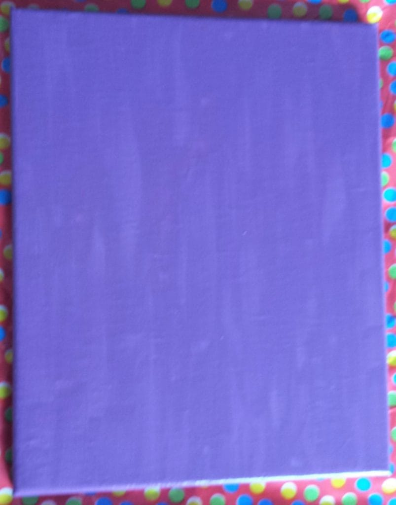 Canvas after the first layer of purple paint.