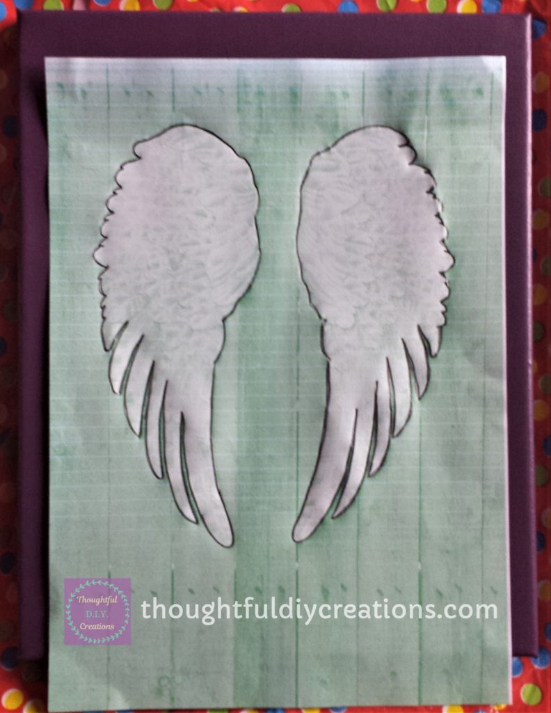 'Angel Wing Silhouette' traced over with a dark 8B graphite pencil.