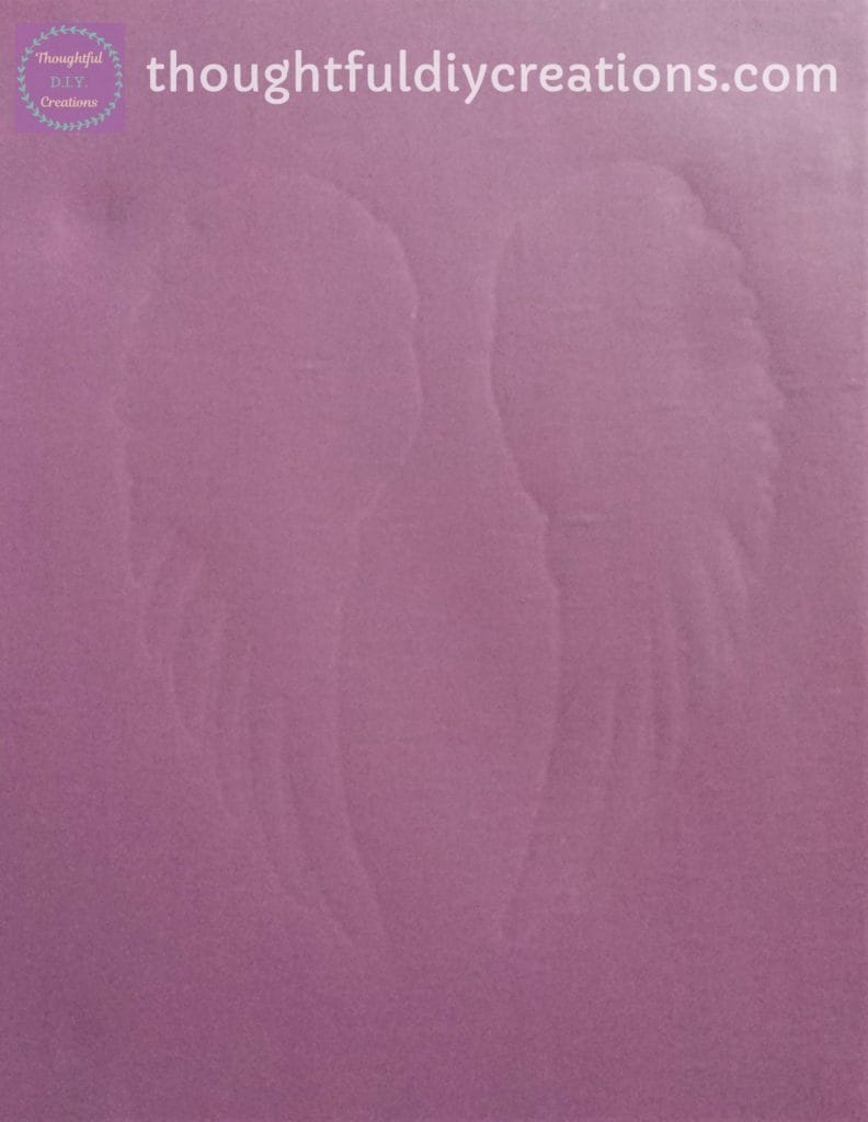 The outline of the Angel Wing Silhouette visible on the canvas.