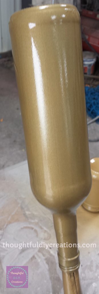 Second Layer of Gold Spray Paint on the Wine Bottle.