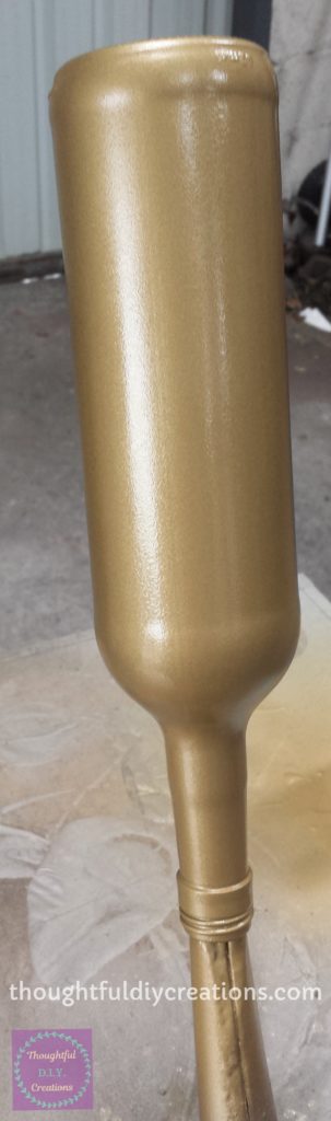 Fourth and Final Layer of gold Spray Paint added to the Wine Bottle.