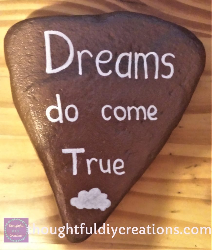 Copper Spray Painted Stone with 'Dreams do come True' Sentiment wrote with a white paint pen.