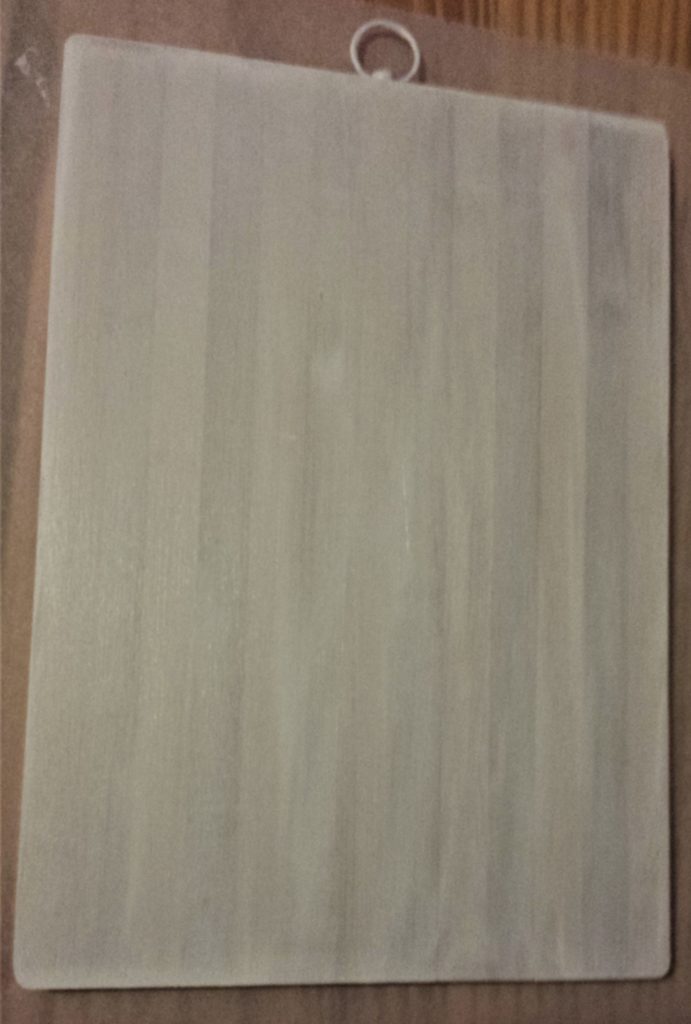 First layer of gesso to the back of the chopping board.