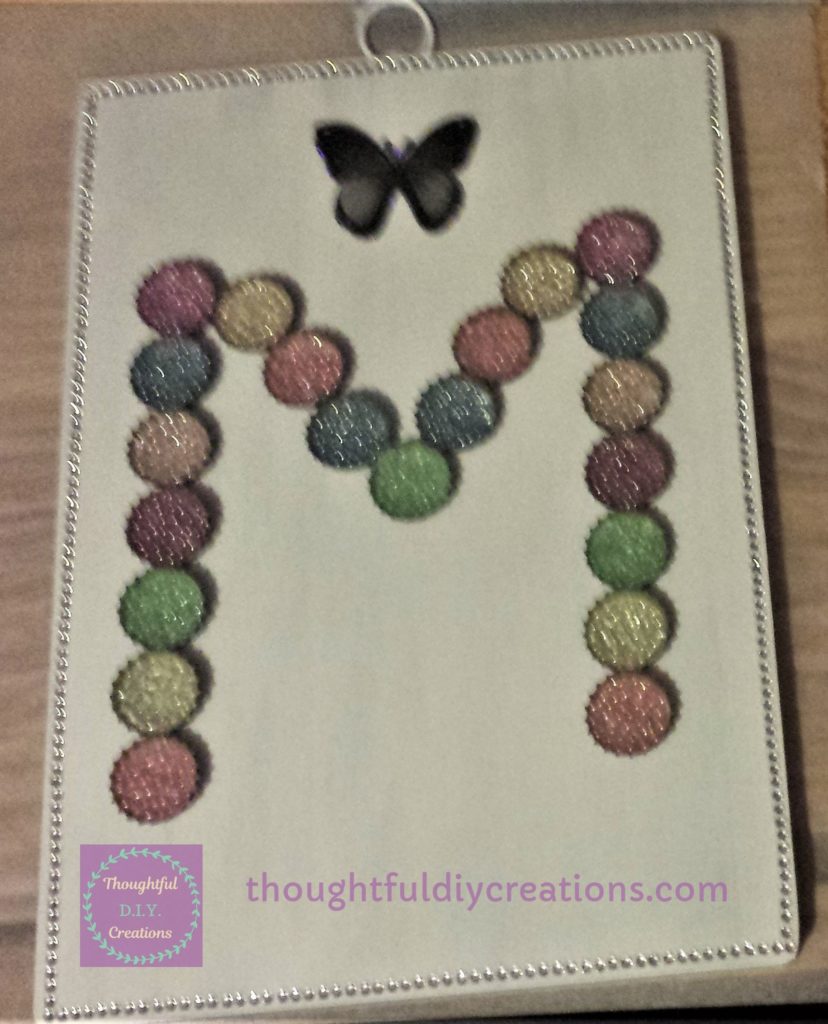 Black and Grey Butterfly Sticker attached to the top mid-section of the chopping board.