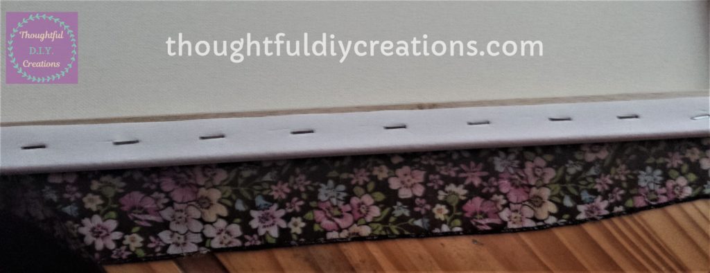 Canvas face down on the floral fabric ready to be glued.