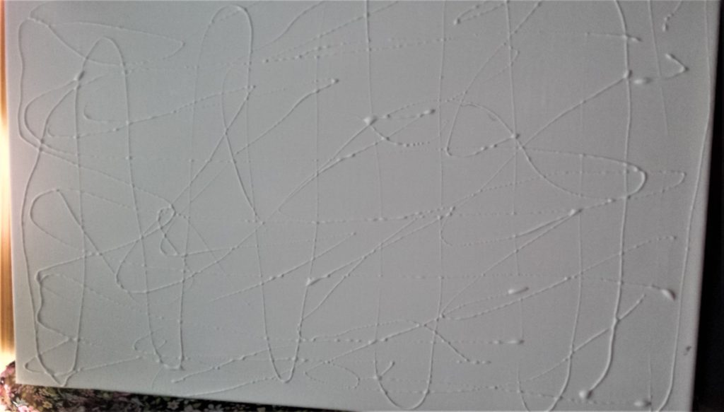 Wood Glue spread out all over the front of the canvas.