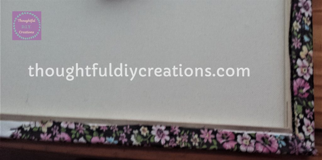 Floral Fabric glued to the second back and side of the canvas.