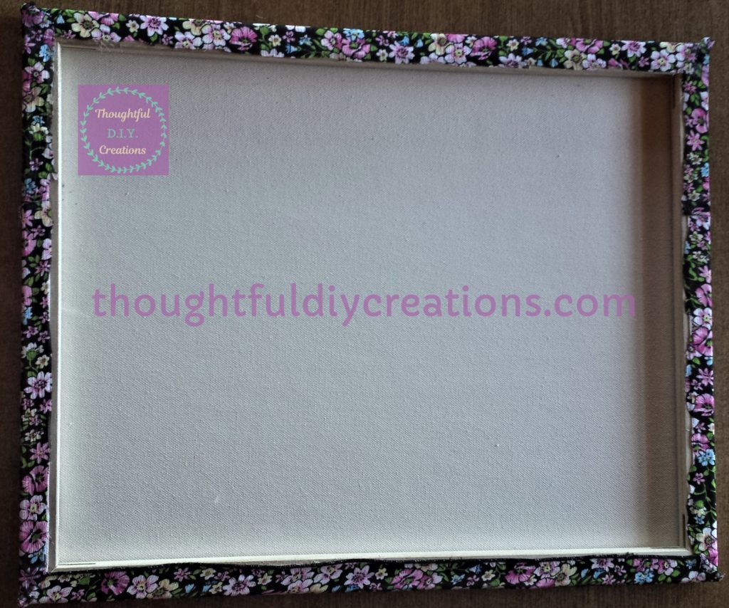 Floral Fabric attached to all 4 sides and back of the canvas.