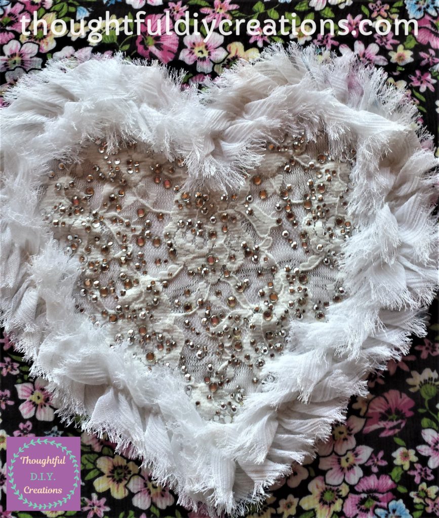 The Fabric Heart after being glued to the canvas.