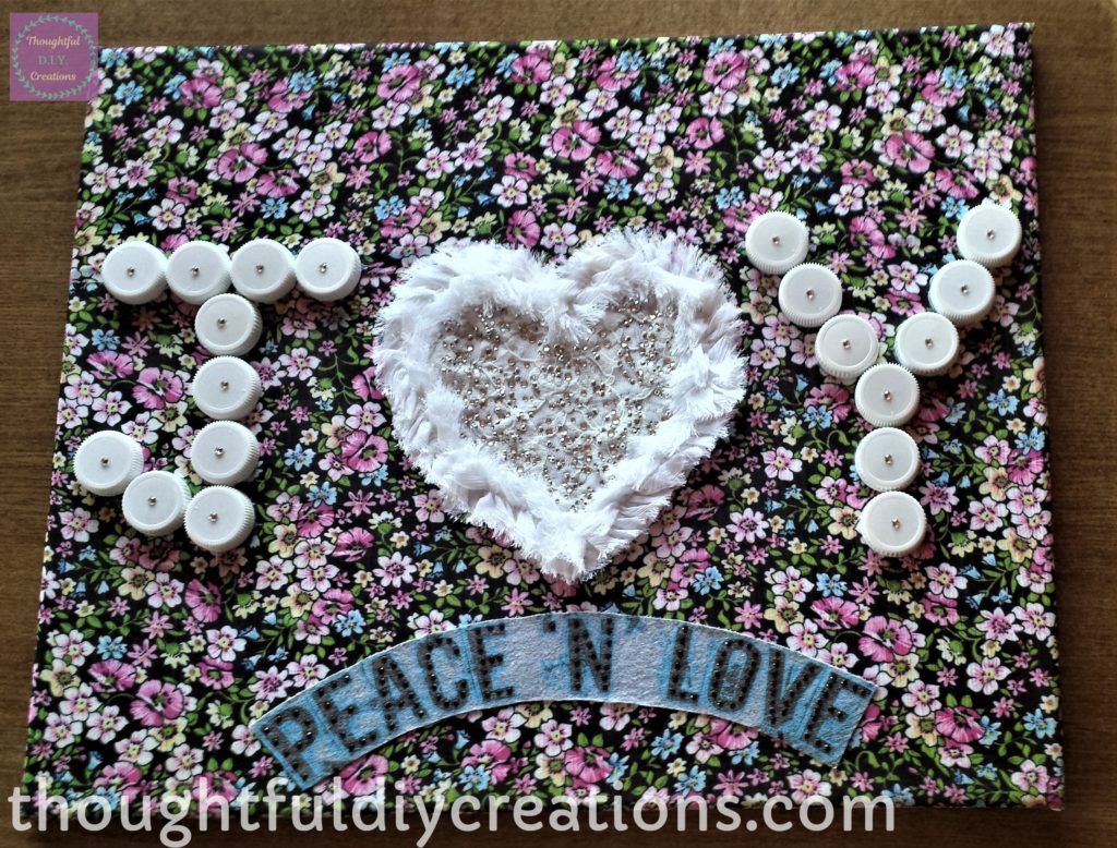 The canvas after the letters 'J' and 'Y' have rhinestones stickers attached.