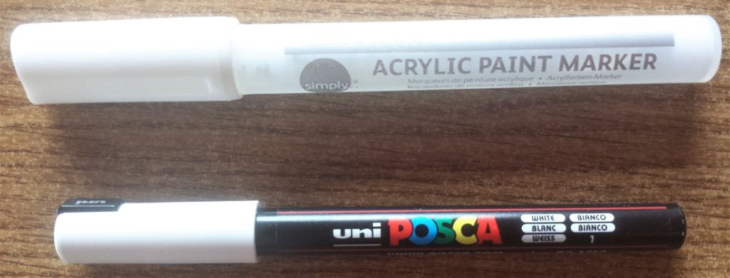 White paint marker and white paint pen.