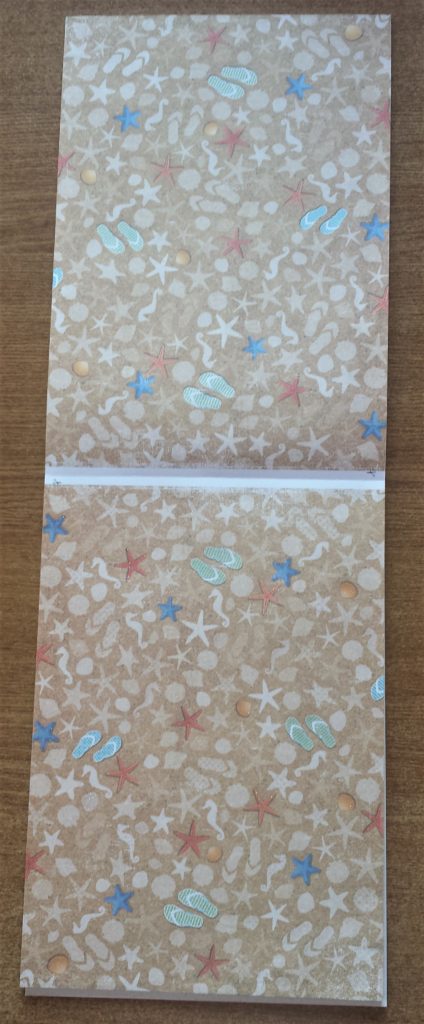 Two sheets of beach themed paper.