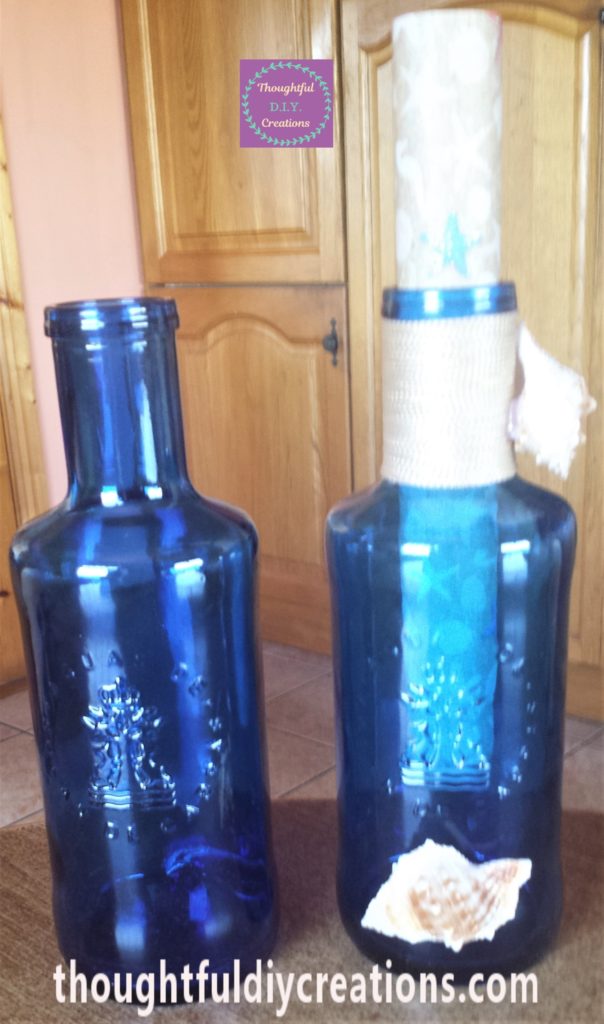 The two blue glass bottles, one before and one after being transformed into a message in a bottle.