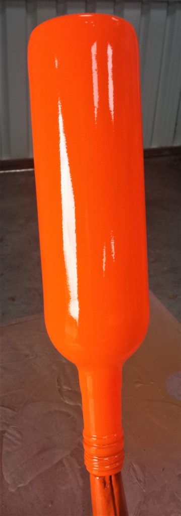 Third and final layer of spray paint on the bottle.