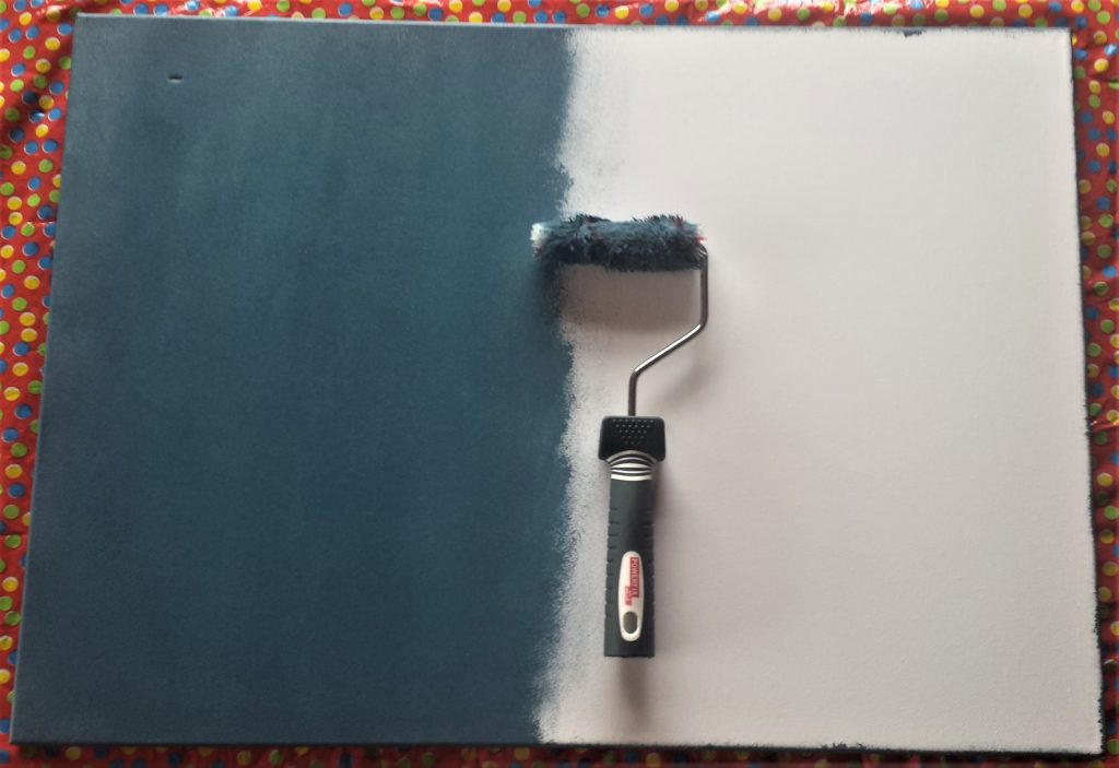 Half of the front of the canvas painted grey.