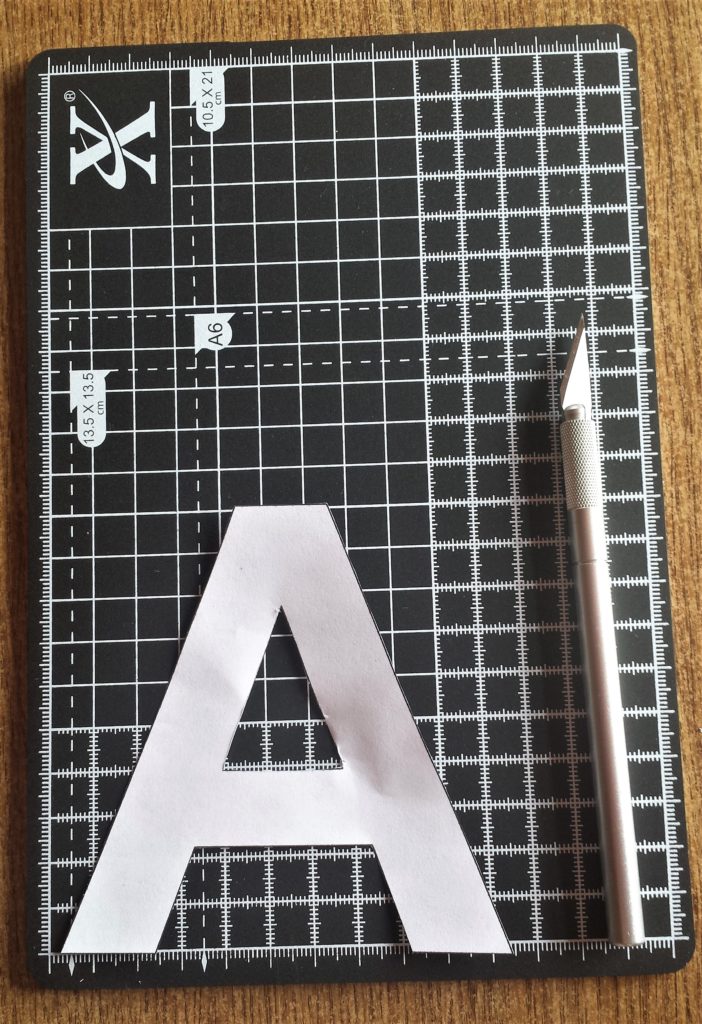 The letter 'A' with the centre cut out with a craft knife.