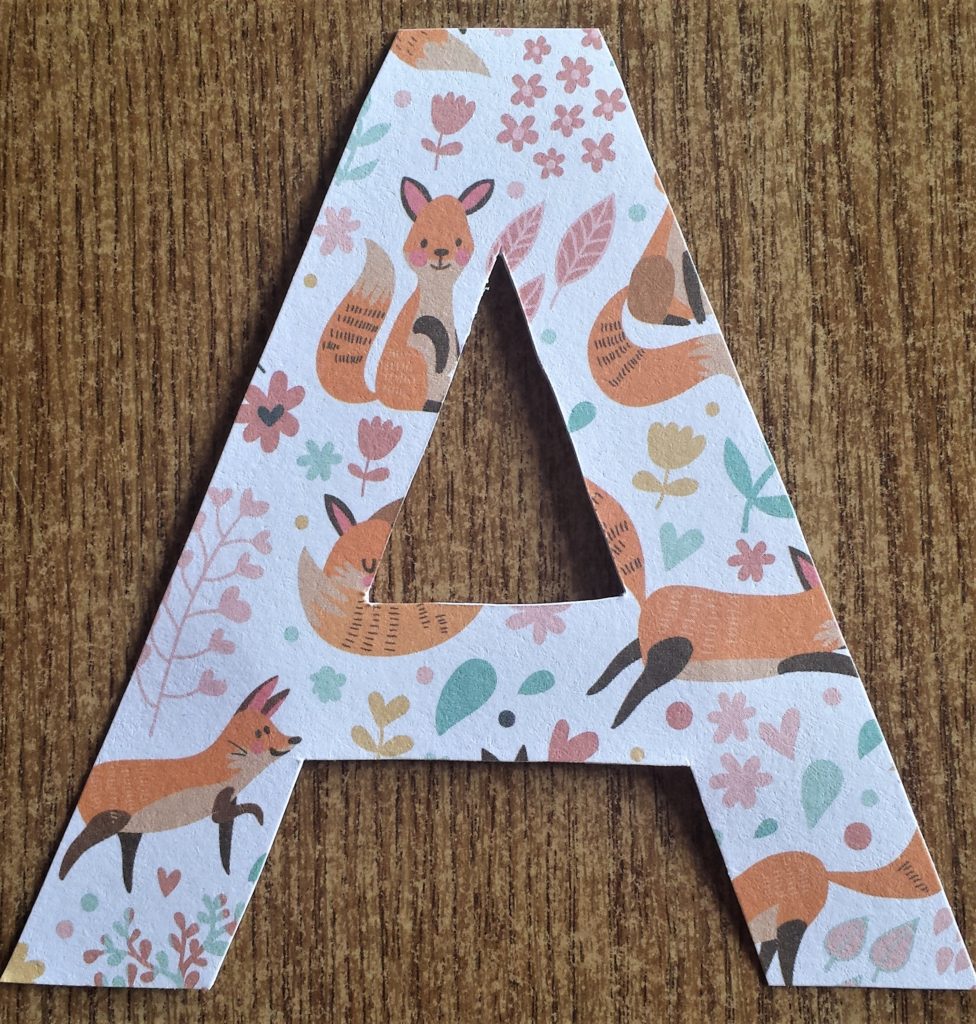 The front of the letter 'A' covered in Autumn paper.