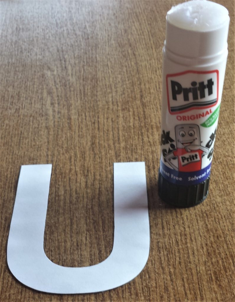 The letter 'U' and Pritt Stick.