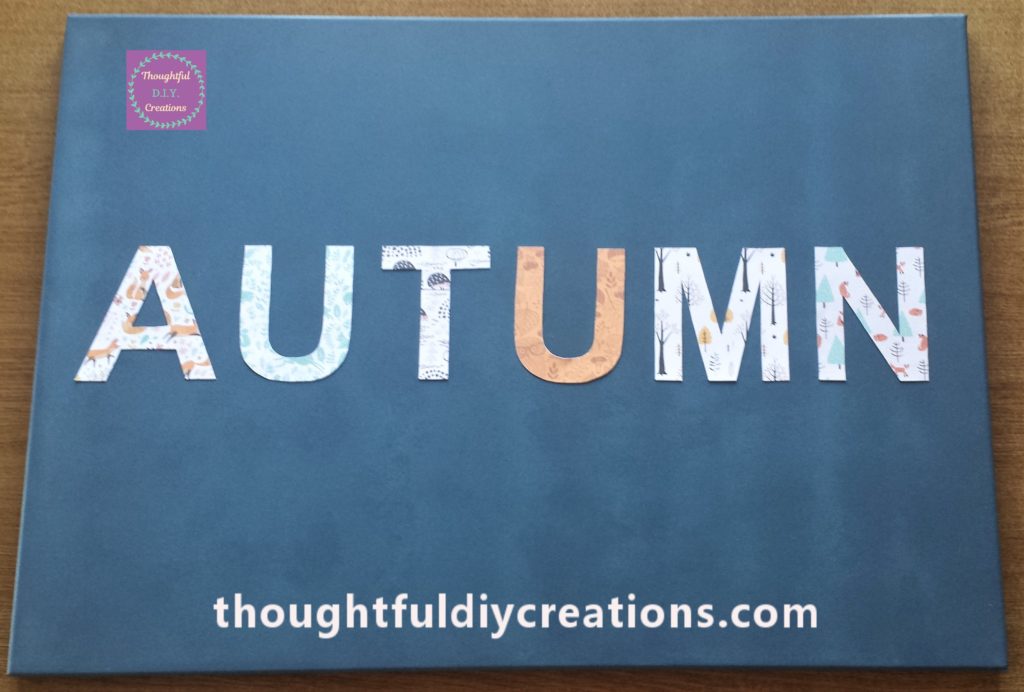Autumn letters all glued to the canvas.