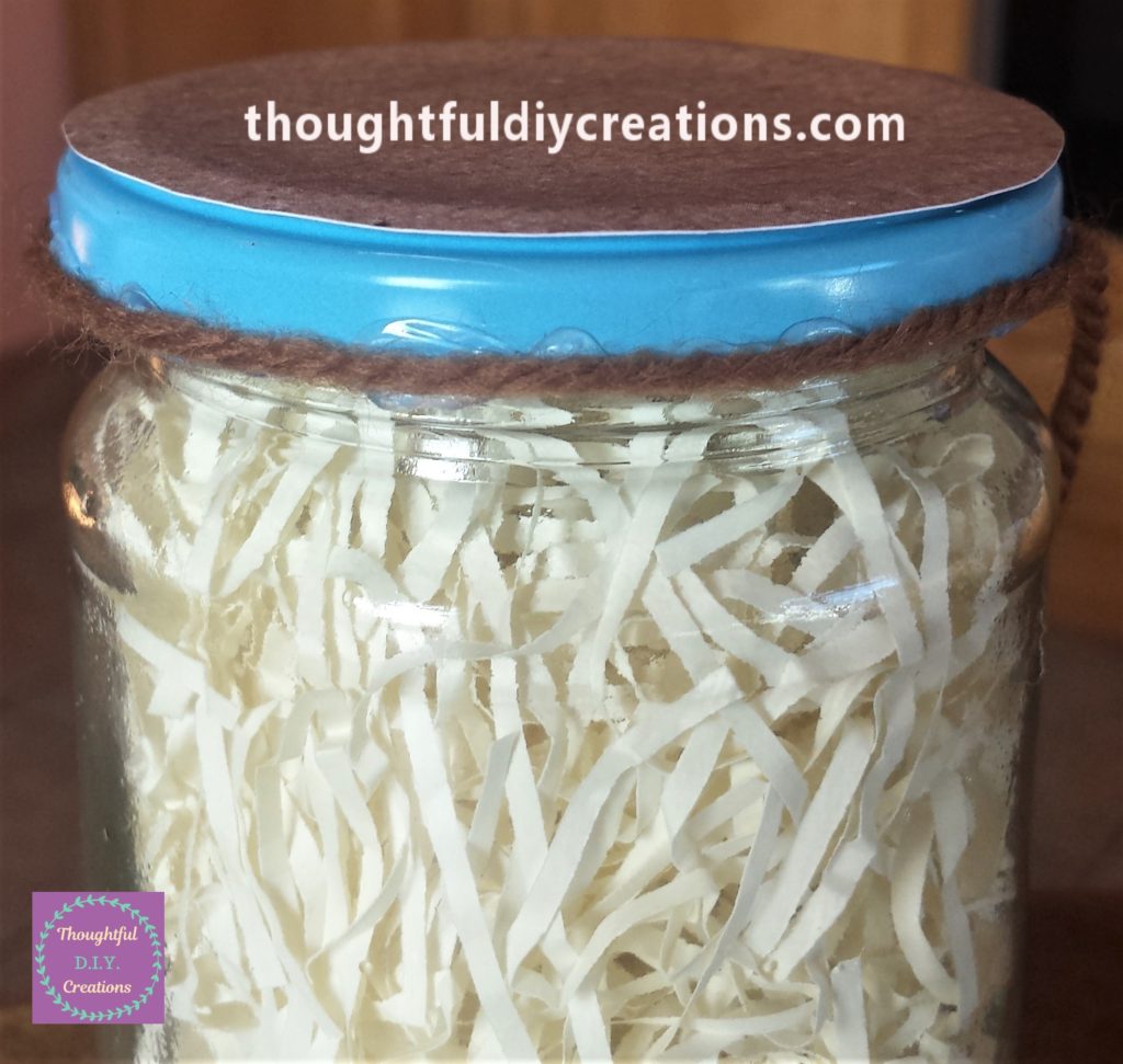 First strip of wool glued to the edge of the lid.