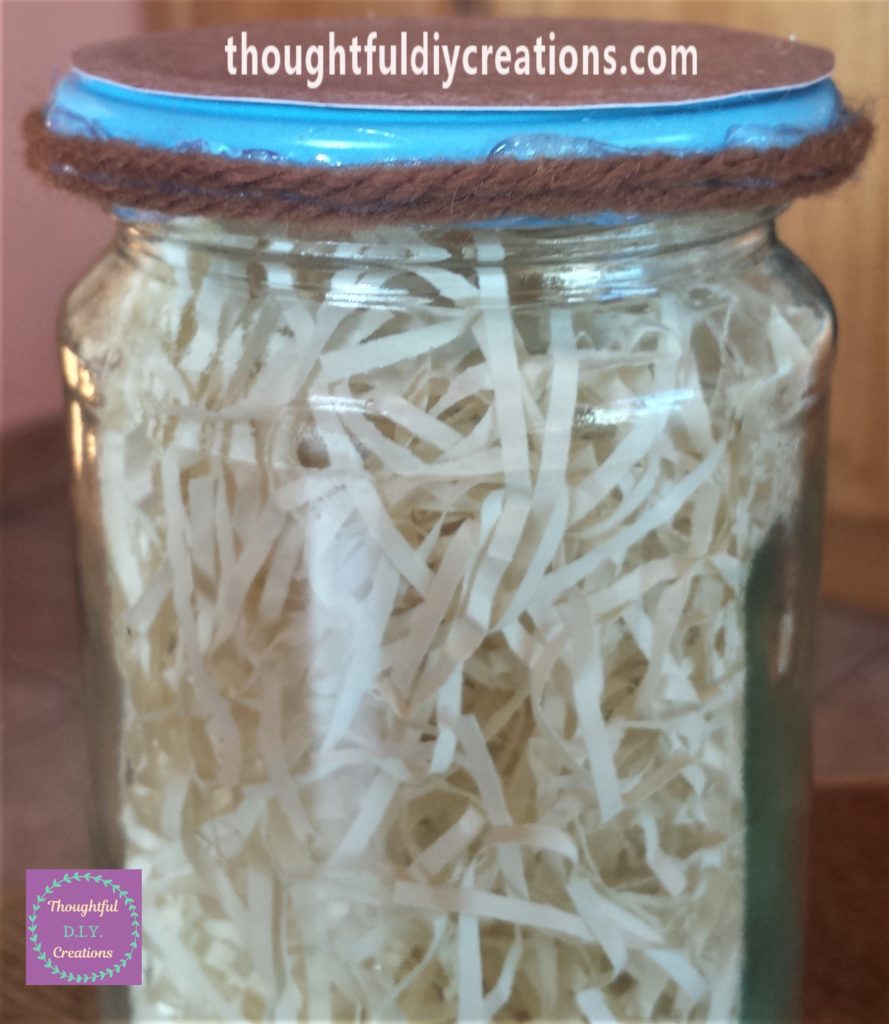 Second layer of wool hot glued to the edge of the lid.