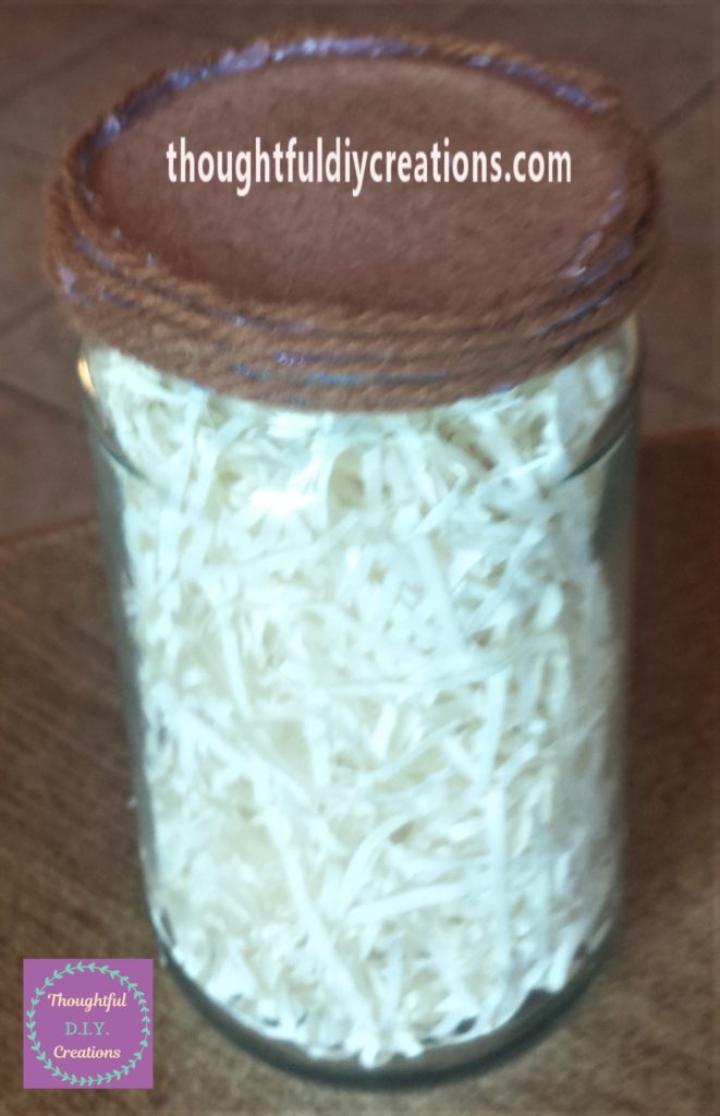 Edge of the lid hot glued and completely covered with wool.