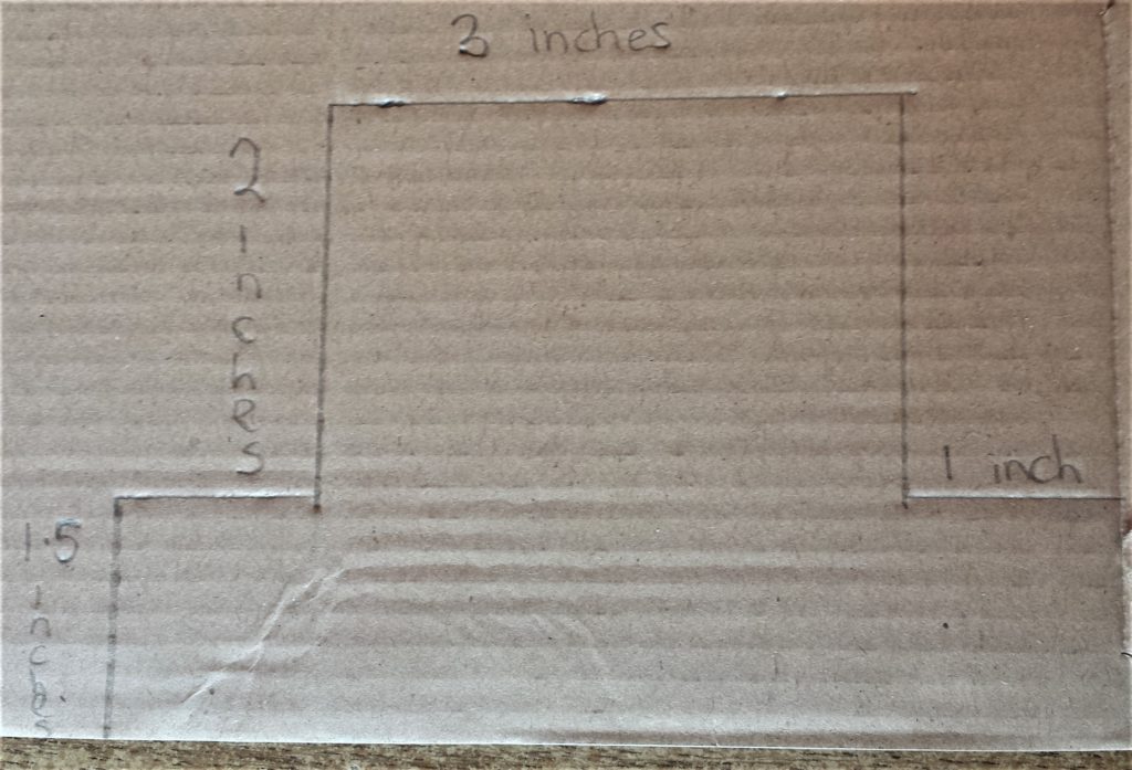 Hat drawn on cardboard with the measurements.