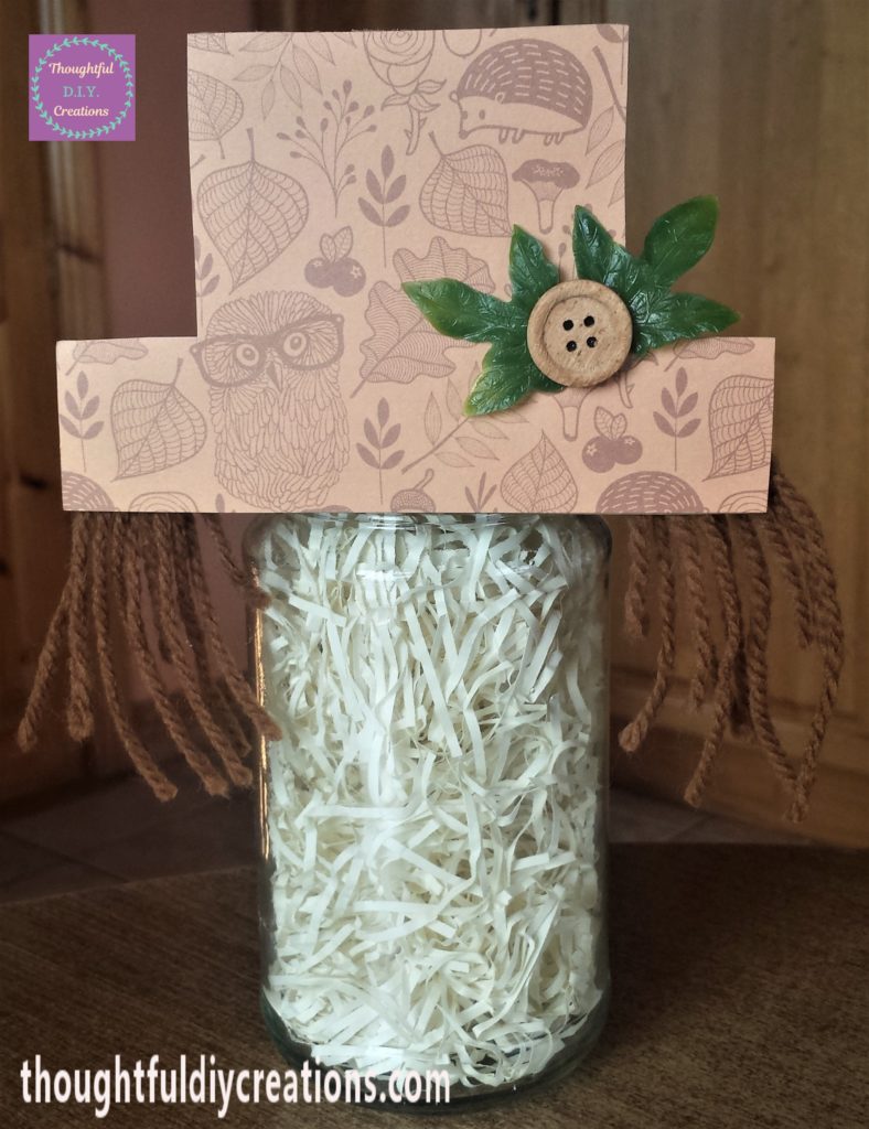 The hat hot glued to the jar.