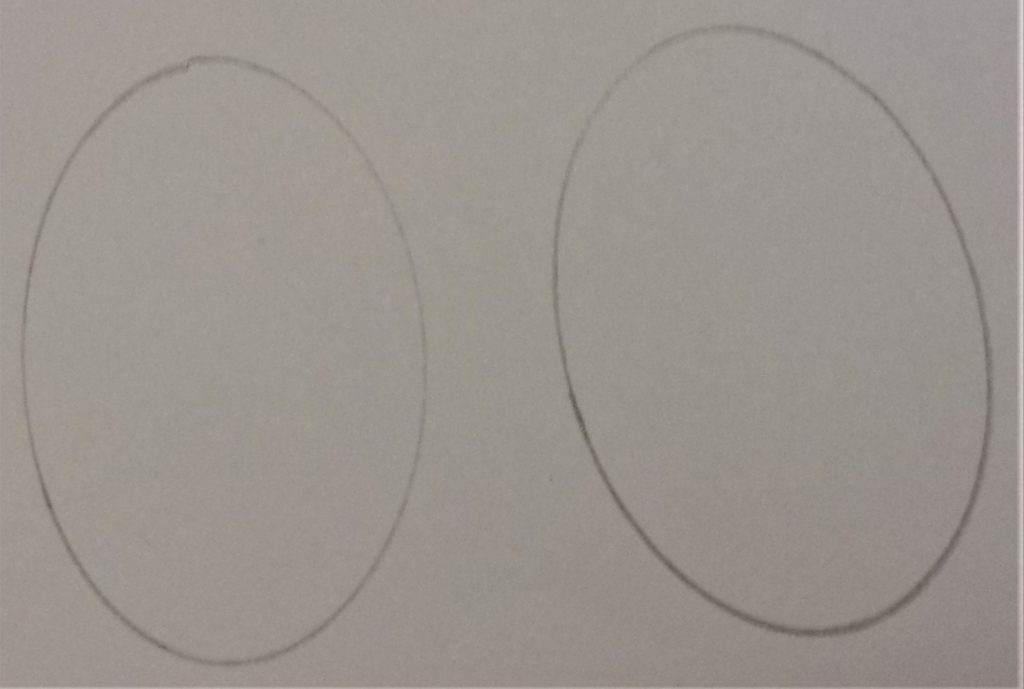Shape of the lid drew onto white paper twice.