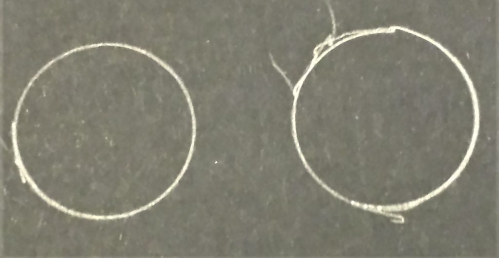 Lid drew around twice on black paper.