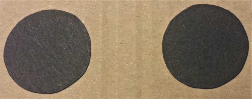 Black part of the eyes cut out.