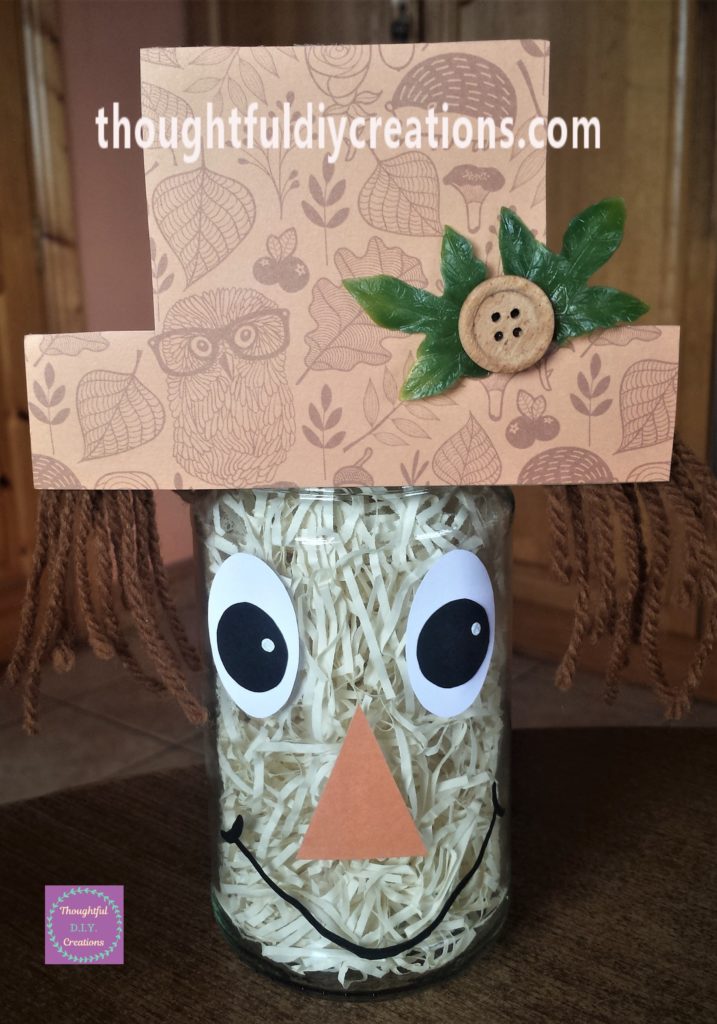 White dots on the scarecrow's eyes.