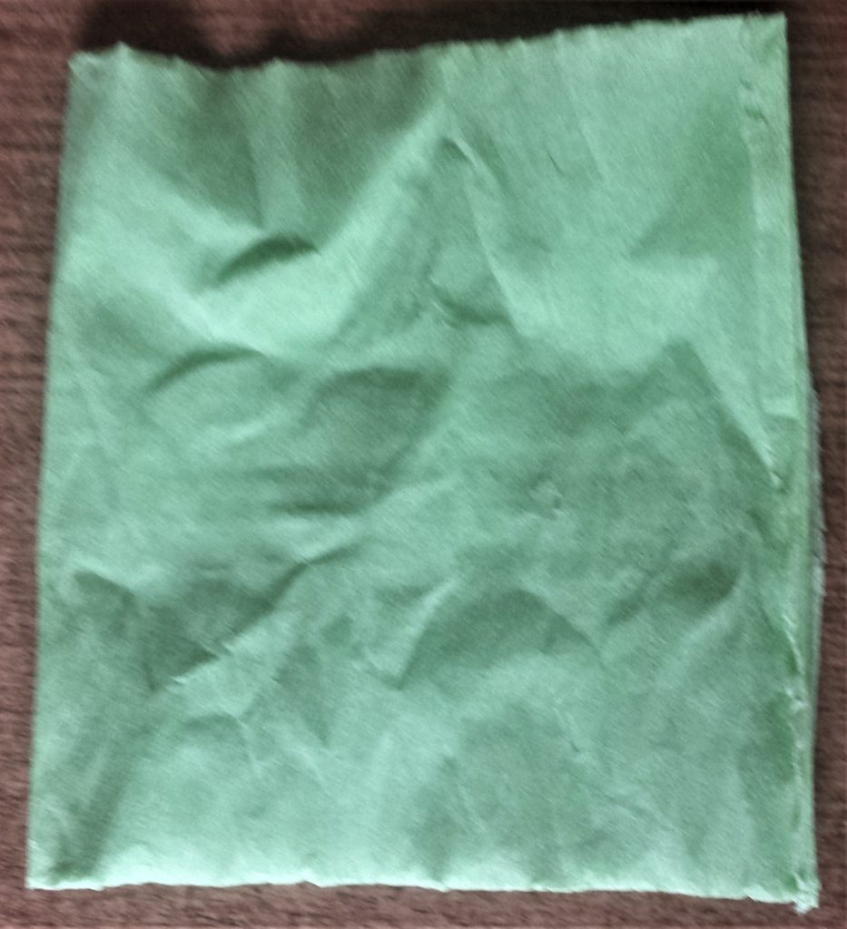 Crepe paper cut and folded in half.