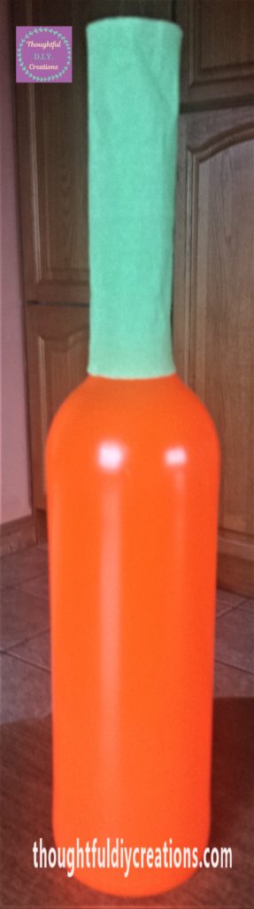 Crepe paper on the neck of the bottle.
