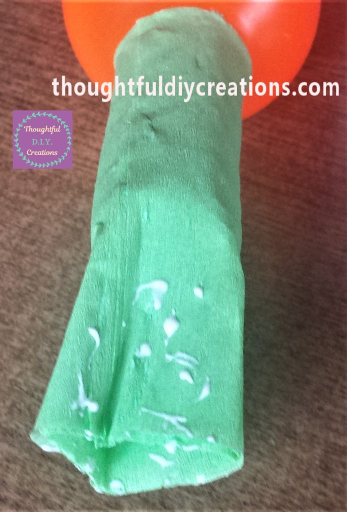 Glue added to the outside of the crepe paper at the top.