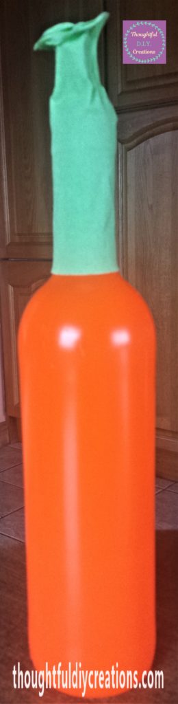 Crepe paper glued together at the top of the bottle.