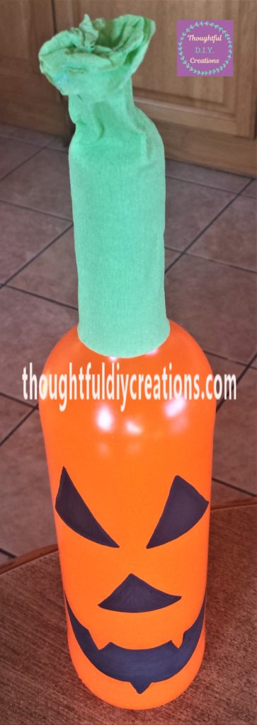 Another layer of paint added to the pumpkins eyes nose and mouth.