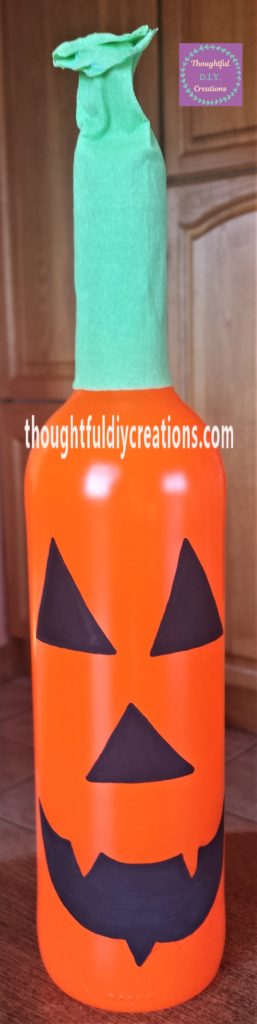 Finished pumpkin bottle from the front view.