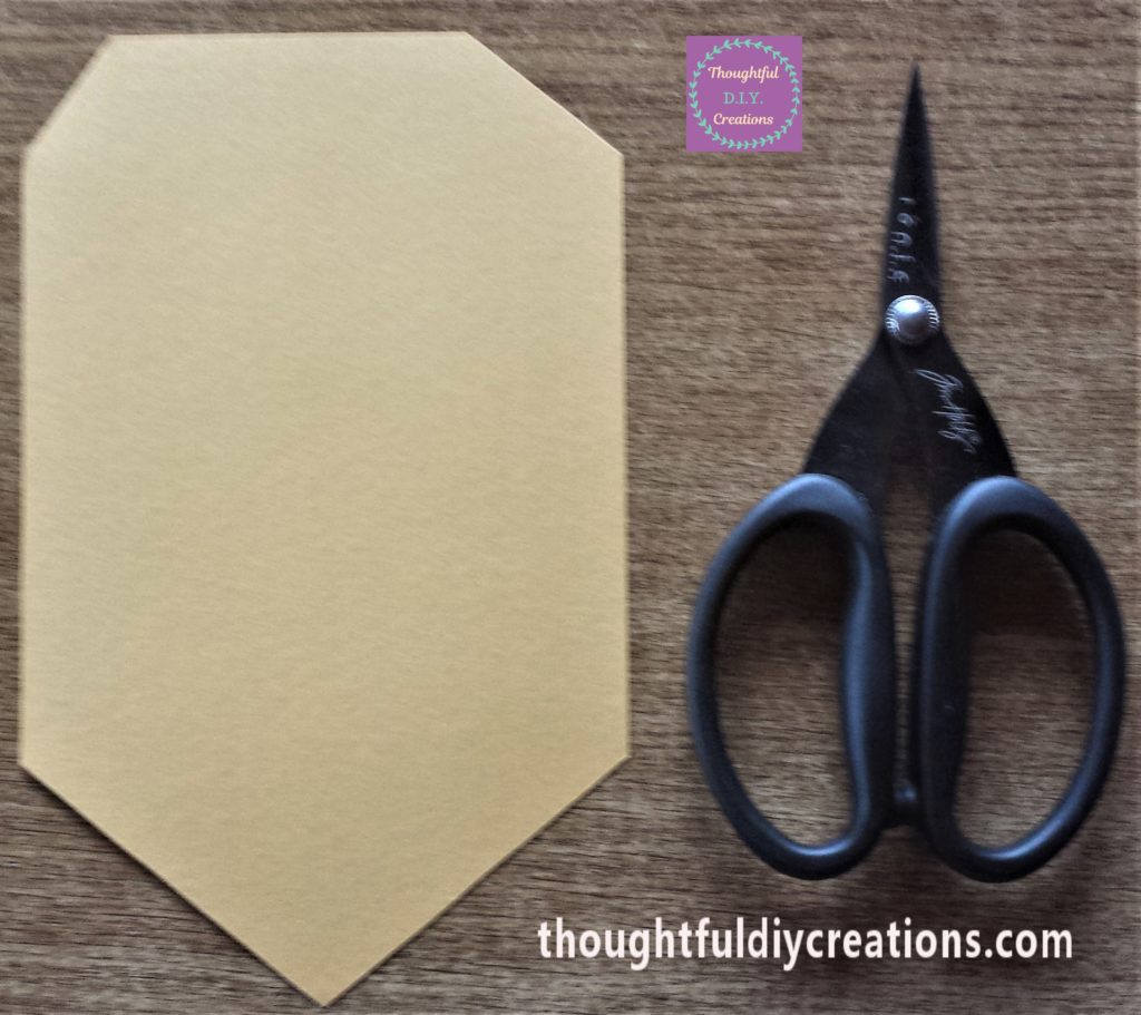 Bunting shape cut out using Tim Holtz Scissors.