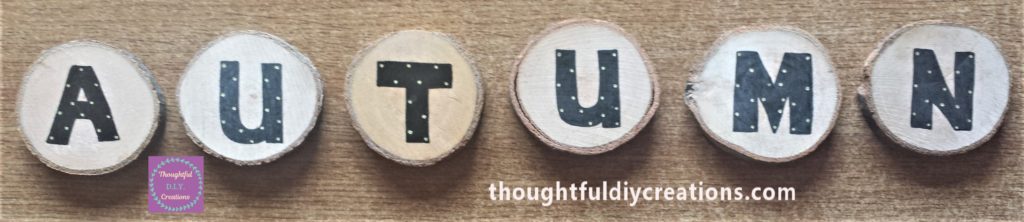 Gold dots added to the letters spelling out AUTUMN using a paint pen.