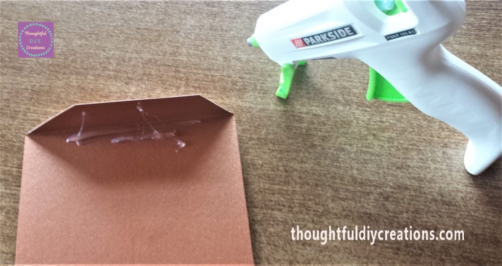 Hot Glue on the back of the fold on the bunting.