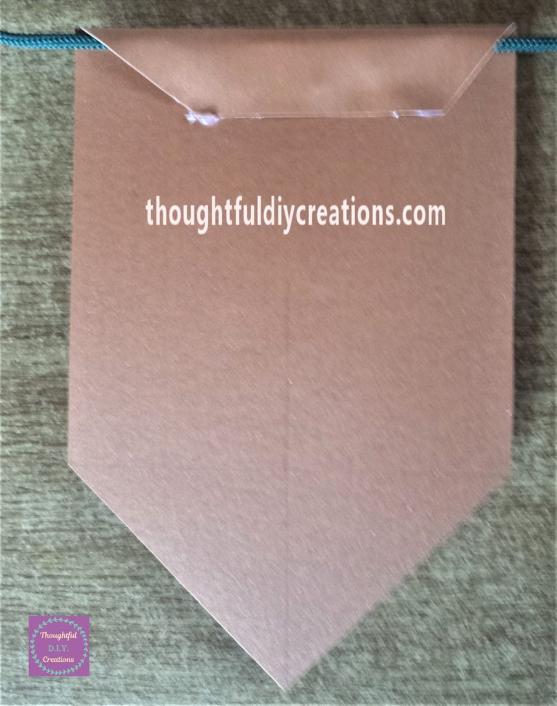 Green string hot glued to the bunting.