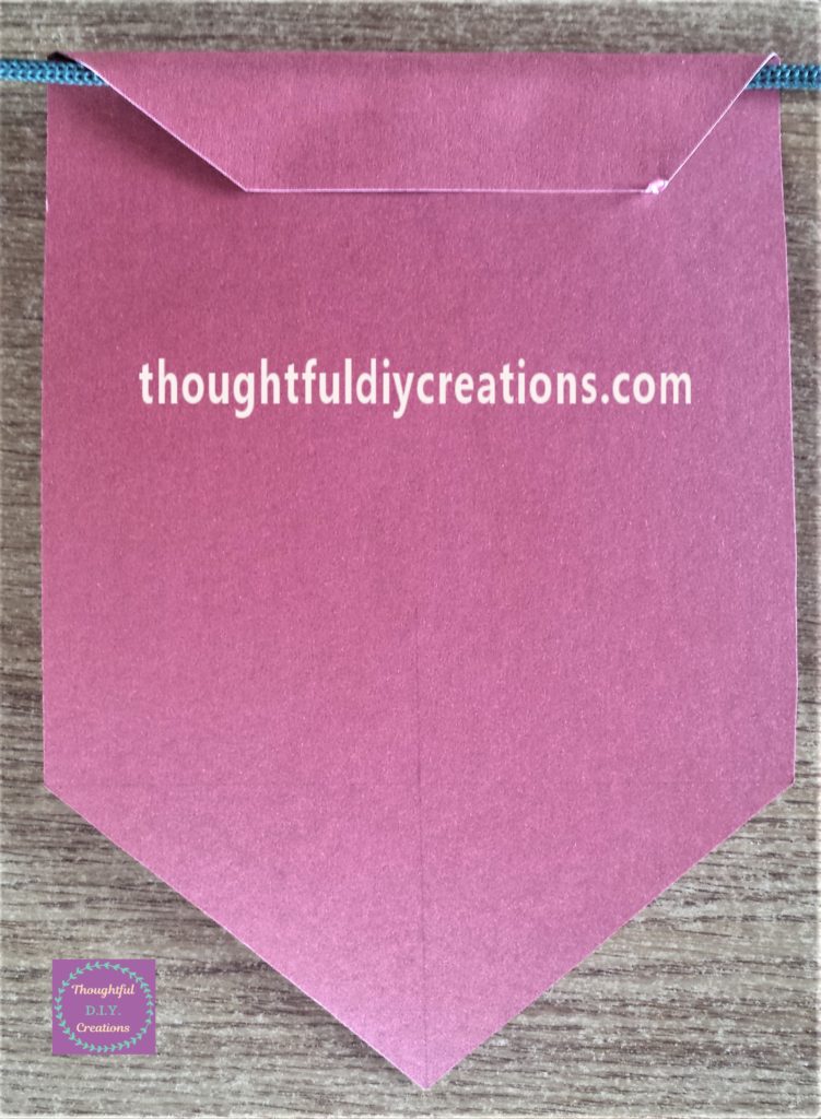 The string hot glued to the back of the bunting.