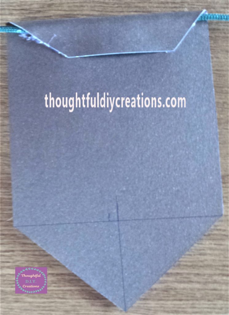 The string hot glued to the back of the bunting.