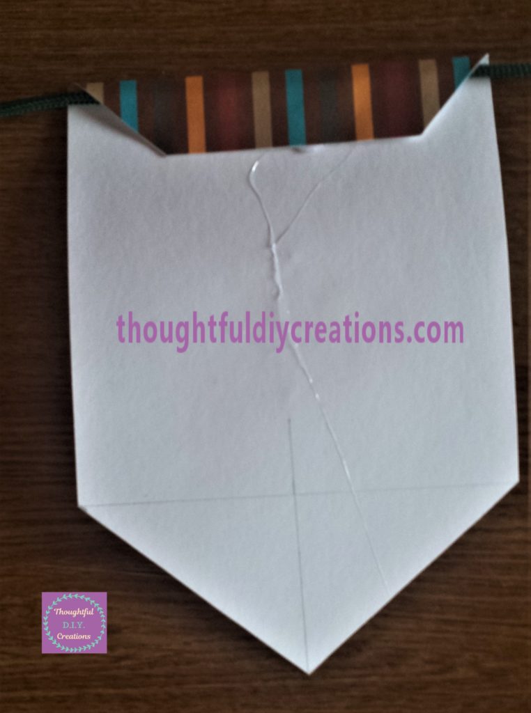 The string hot glued to the back of the bunting.