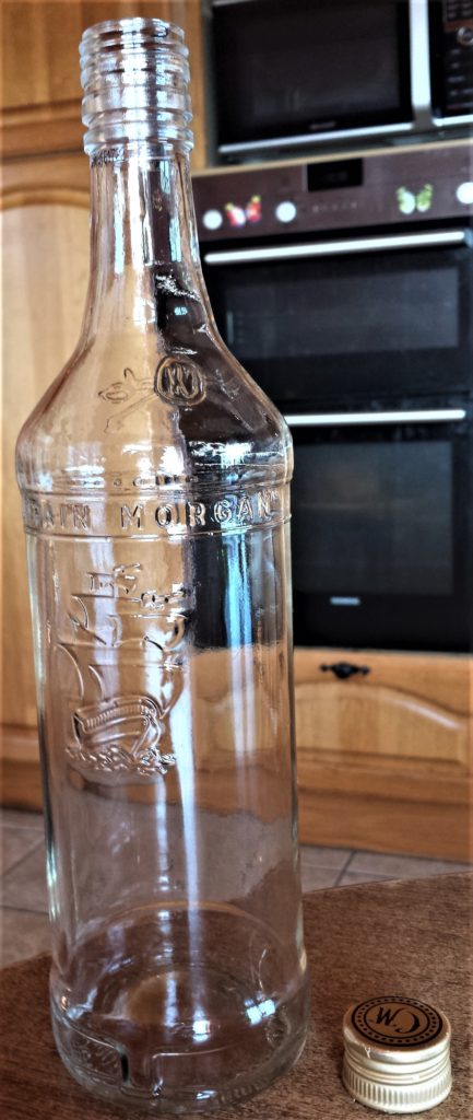 Bottle after being soaked in the sink and the label removed.