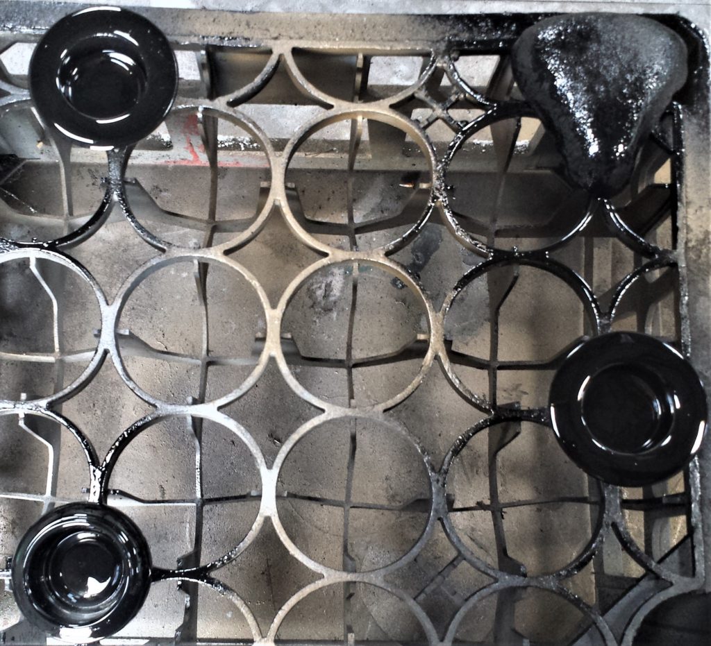 The candle holders after being spray painted.