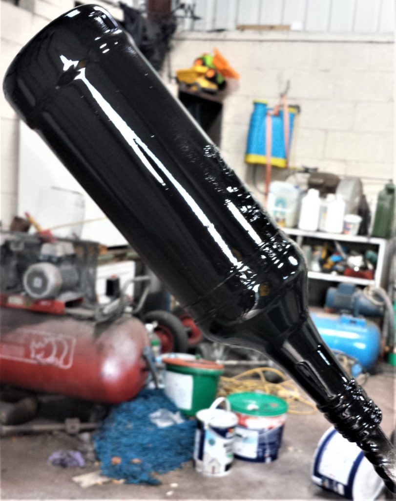 The bottle after 1 coat of spray paint.