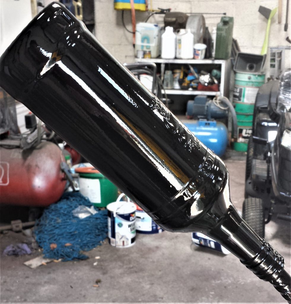 The bottle after being spray painted a second time.