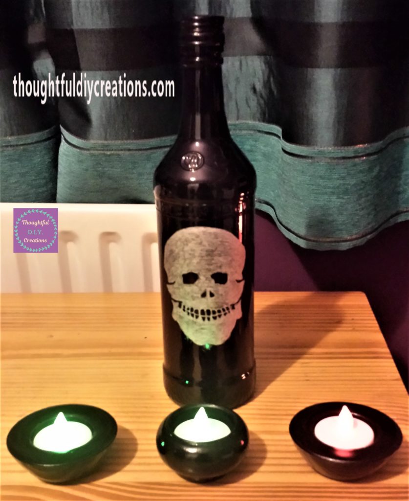 Completed Skull Bottle and Spray Painted Candle Holders.
